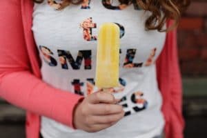Woman holding a Popsicle
